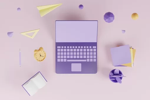 laptop and book representing professional goals